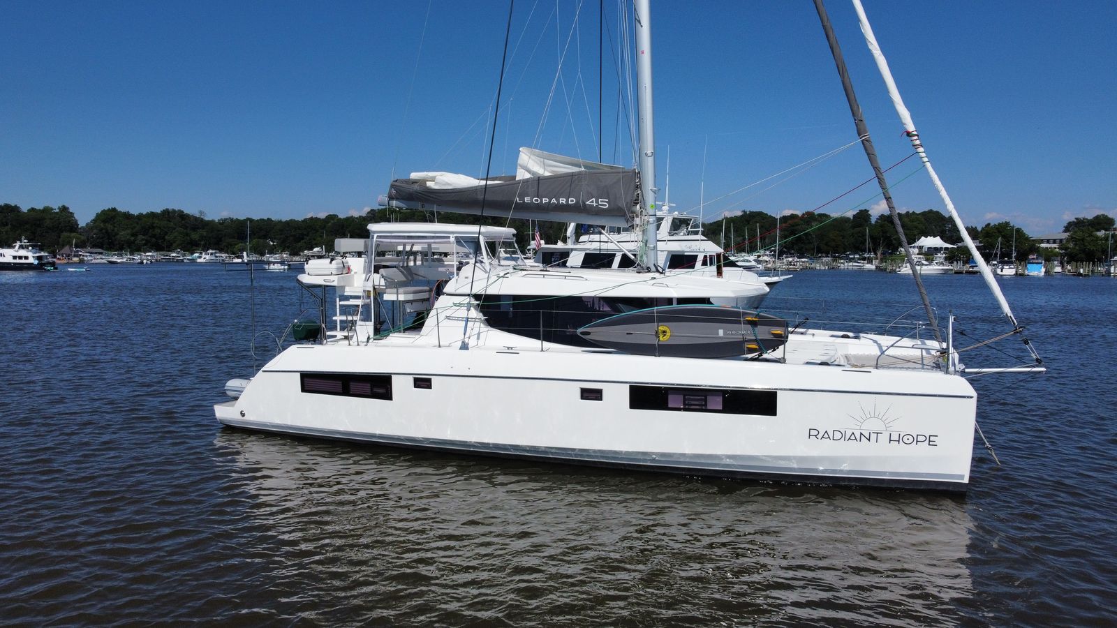 Full starboard side profile of empty boat at dock
