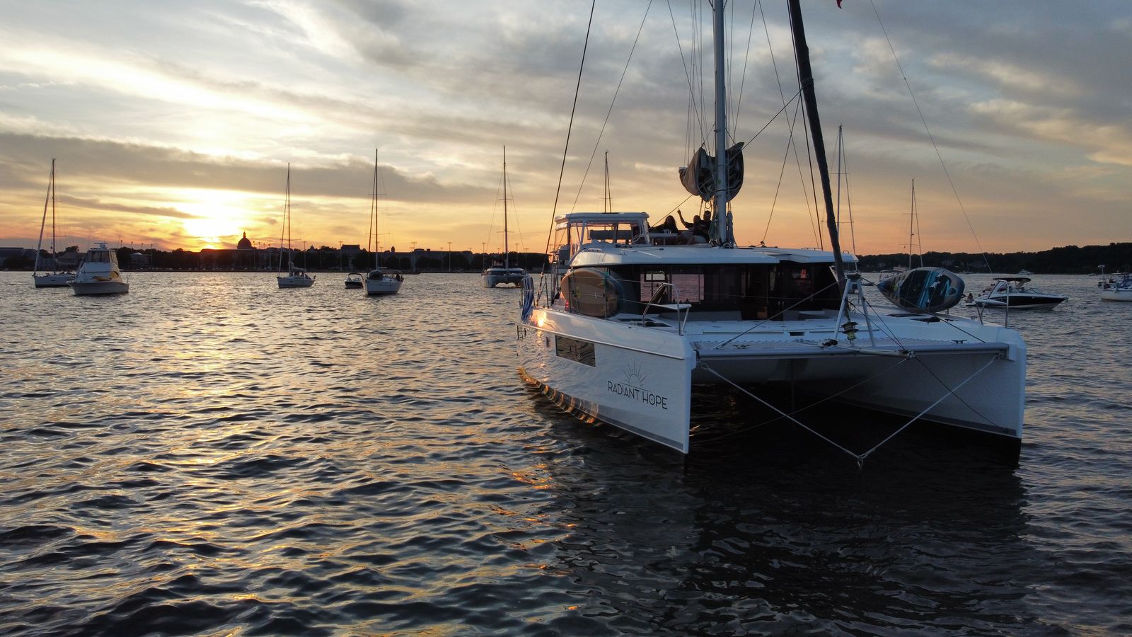 Stern and bow view at sunset with Radiant Hope visible